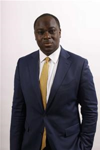 Headshot of Councillor Jason Ochere wearing a suit